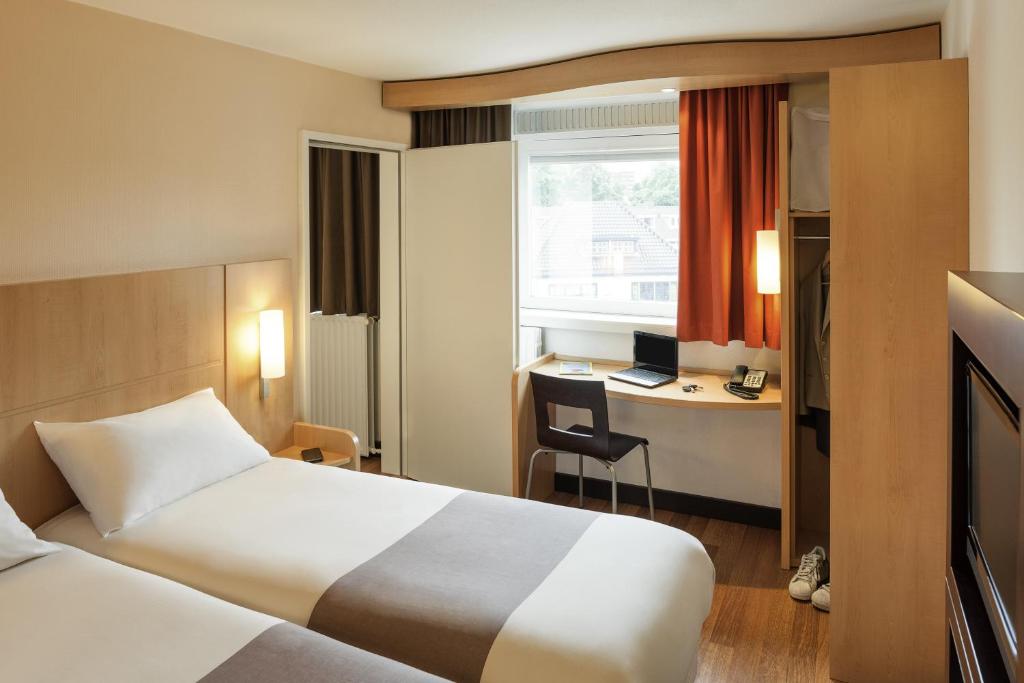 Postel nebo postele na pokoji v ubytování ibis Liège Seraing