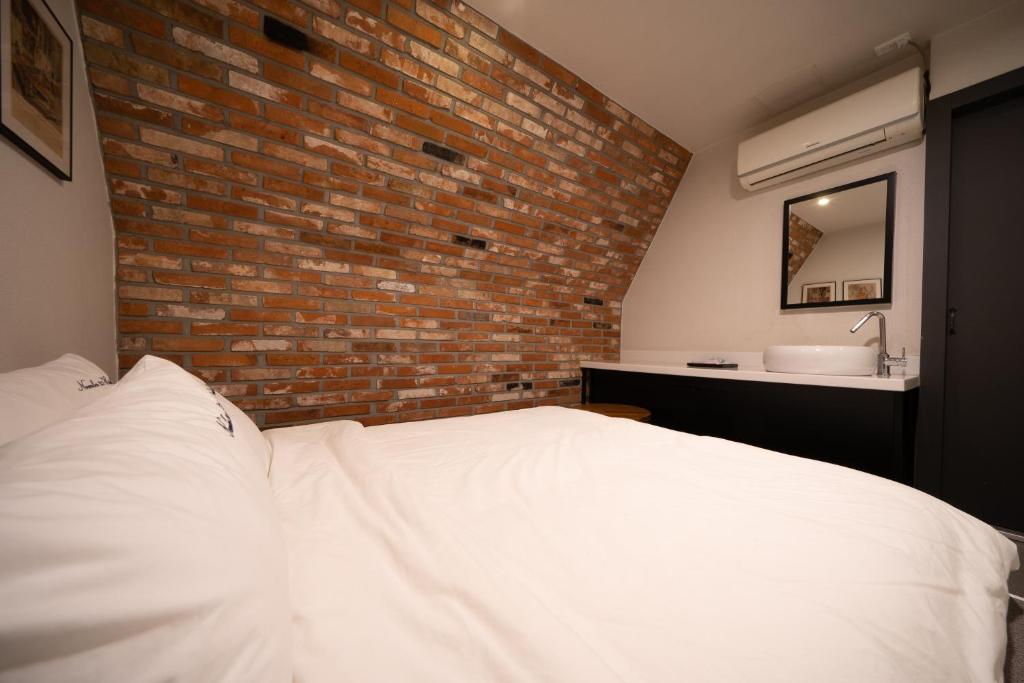 Postel nebo postele na pokoji v ubytování No25 Hotel Yeonsan