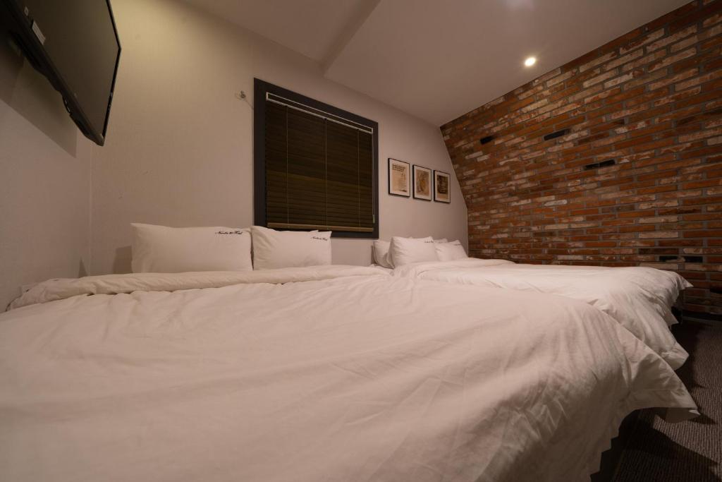 Postel nebo postele na pokoji v ubytování No25 Hotel Yeonsan