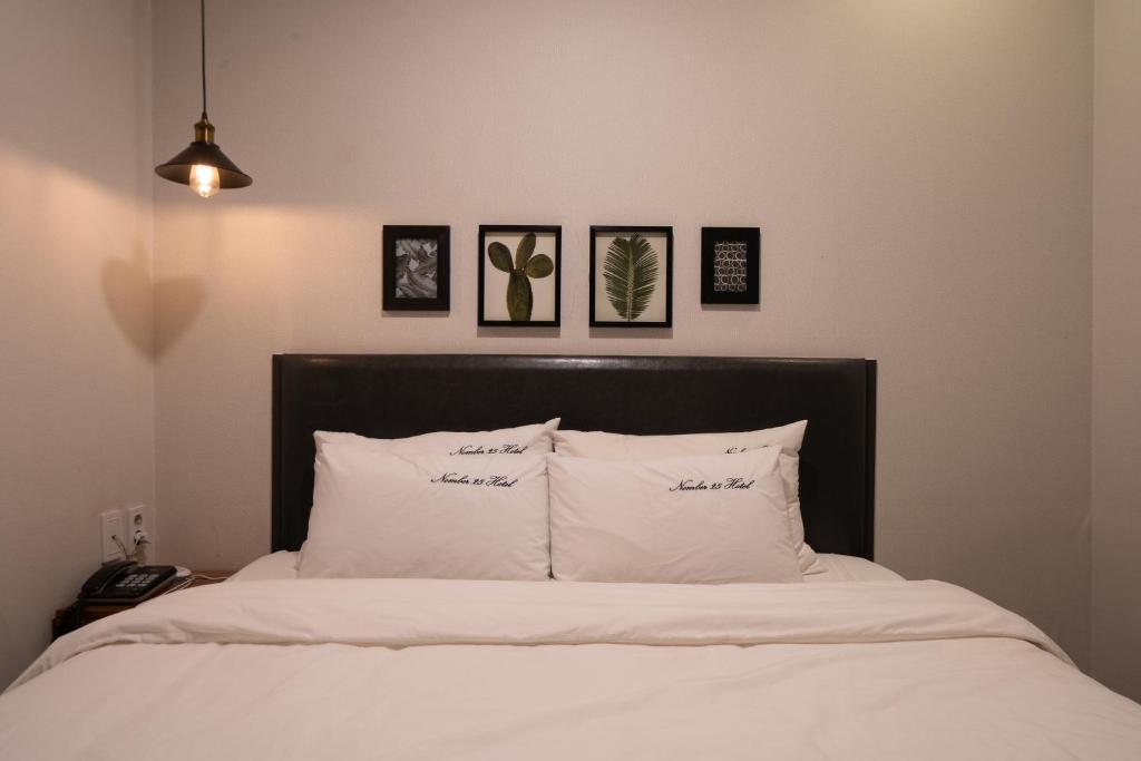 Postel nebo postele na pokoji v ubytování No25 Hotel Yeonsan