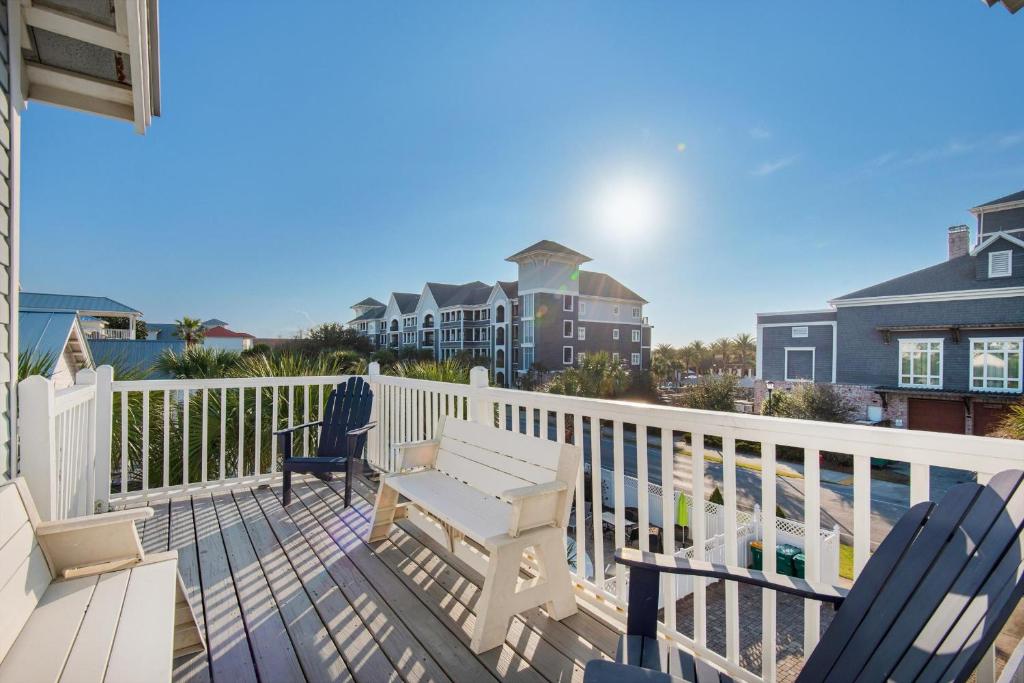 a deck with chairs and a table on a balcony at Beach House of Stress Relief in Destin