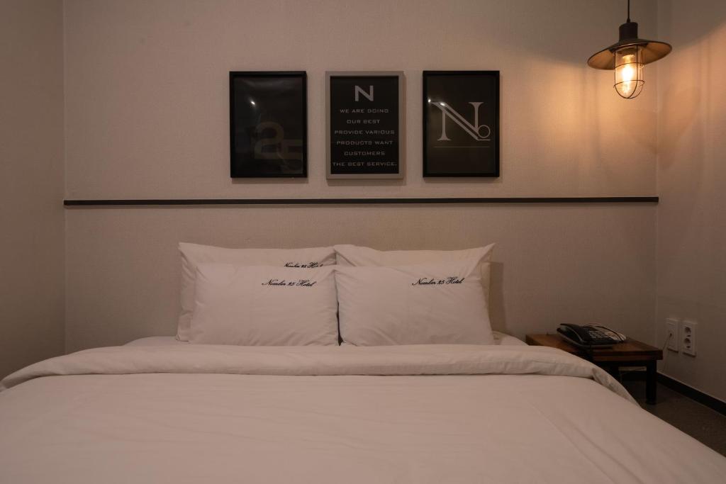 Postel nebo postele na pokoji v ubytování No25 Hotel Yeonsan