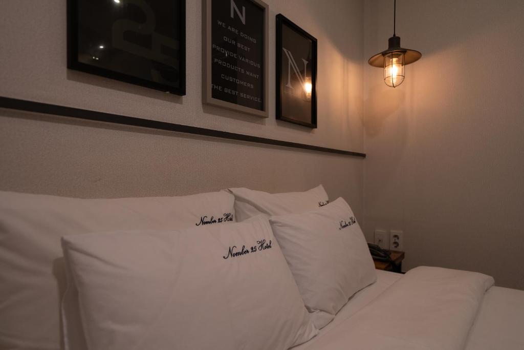 Postel nebo postele na pokoji v ubytování No25 Hotel Yeonsan