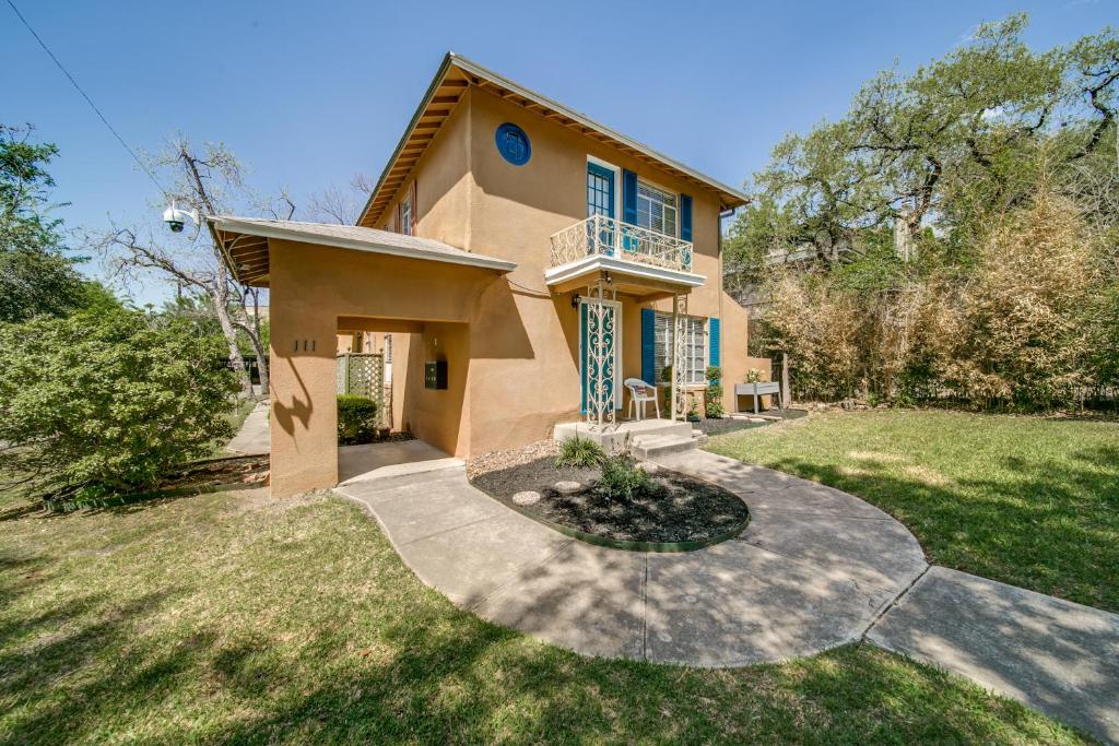 a house with a balcony and a yard at Historical Home in Iconic Alamo Heights - Sky view in San Antonio