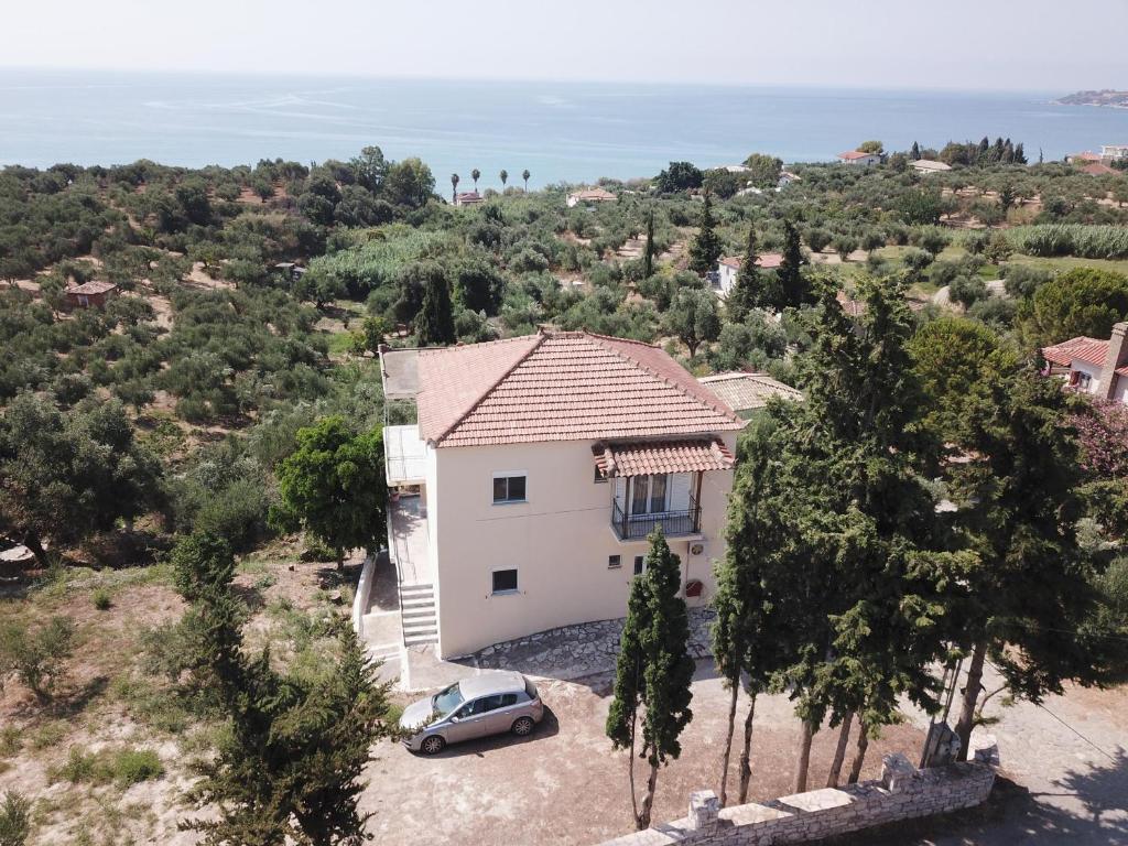 an aerial view of a white house with a car at Anastassia EG in Koroni