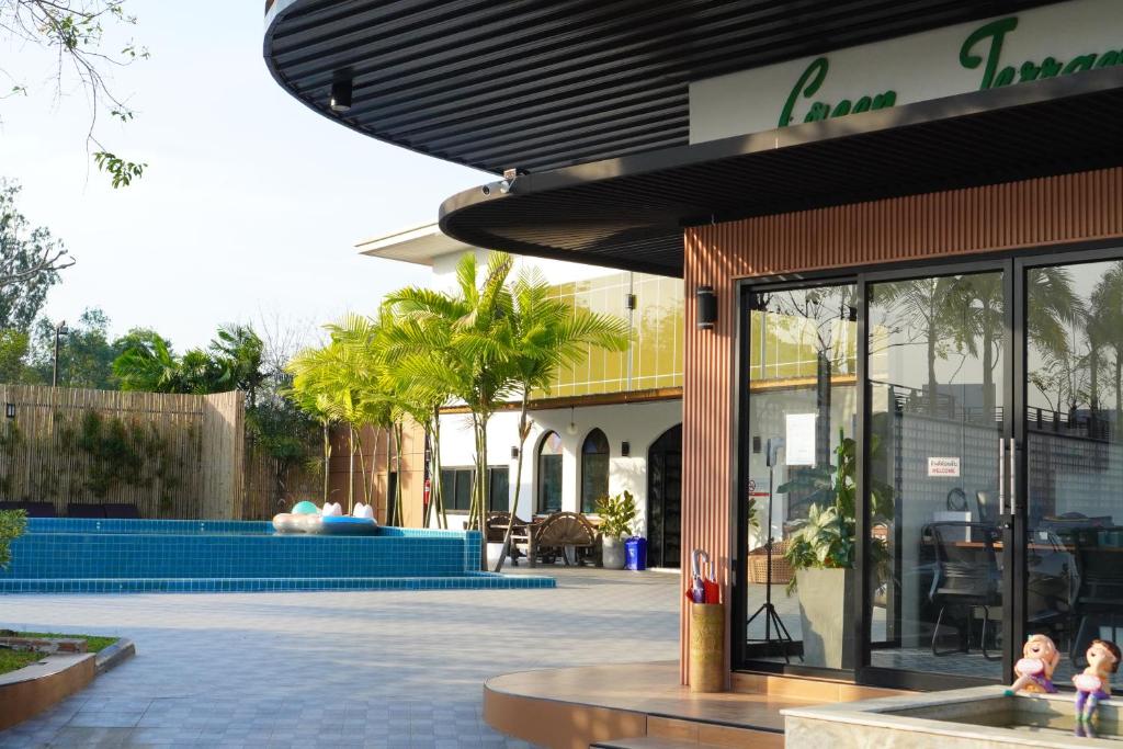 a store front with a pool in a courtyard at Annowa Resort - Chanthaburi in Chanthaburi