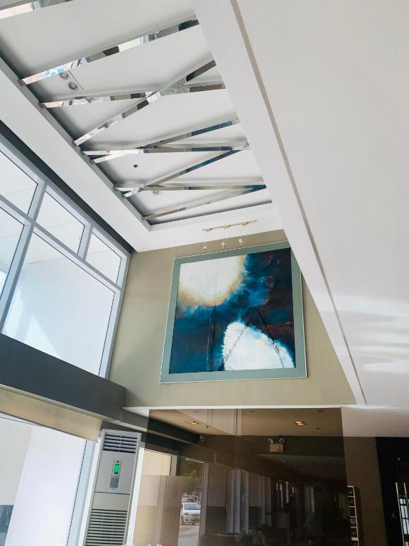 a large painting on the ceiling of a building at Sea Residences - Property Val Alano 0995-448-8872 in Manila