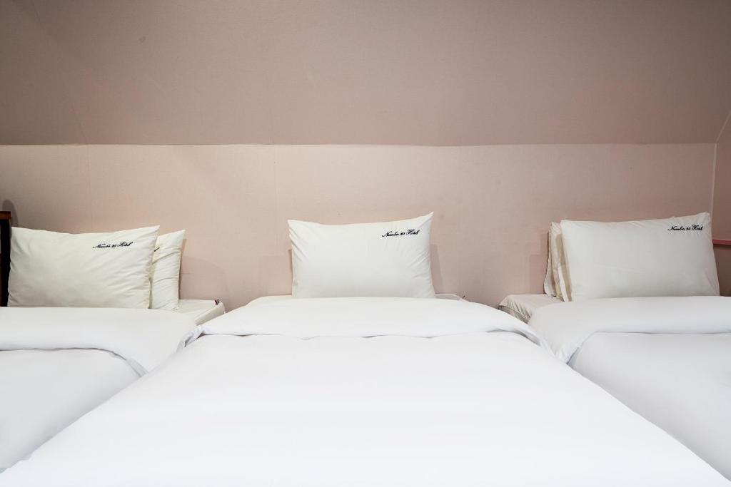 Postel nebo postele na pokoji v ubytování No25 Hotel Yeonsan
