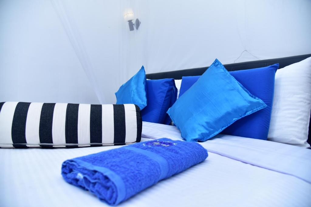 Postel nebo postele na pokoji v ubytování Ella Nimal Nest Inn
