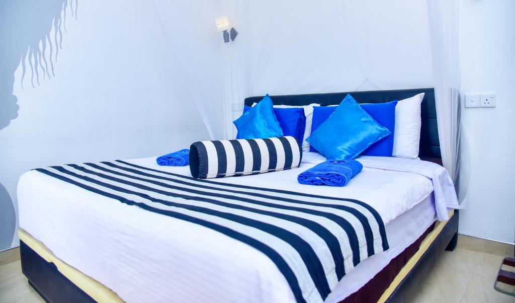 Postel nebo postele na pokoji v ubytování Ella Nimal Nest Inn