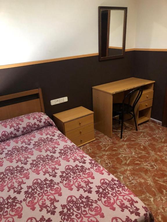 Postel nebo postele na pokoji v ubytování Hotel Manises