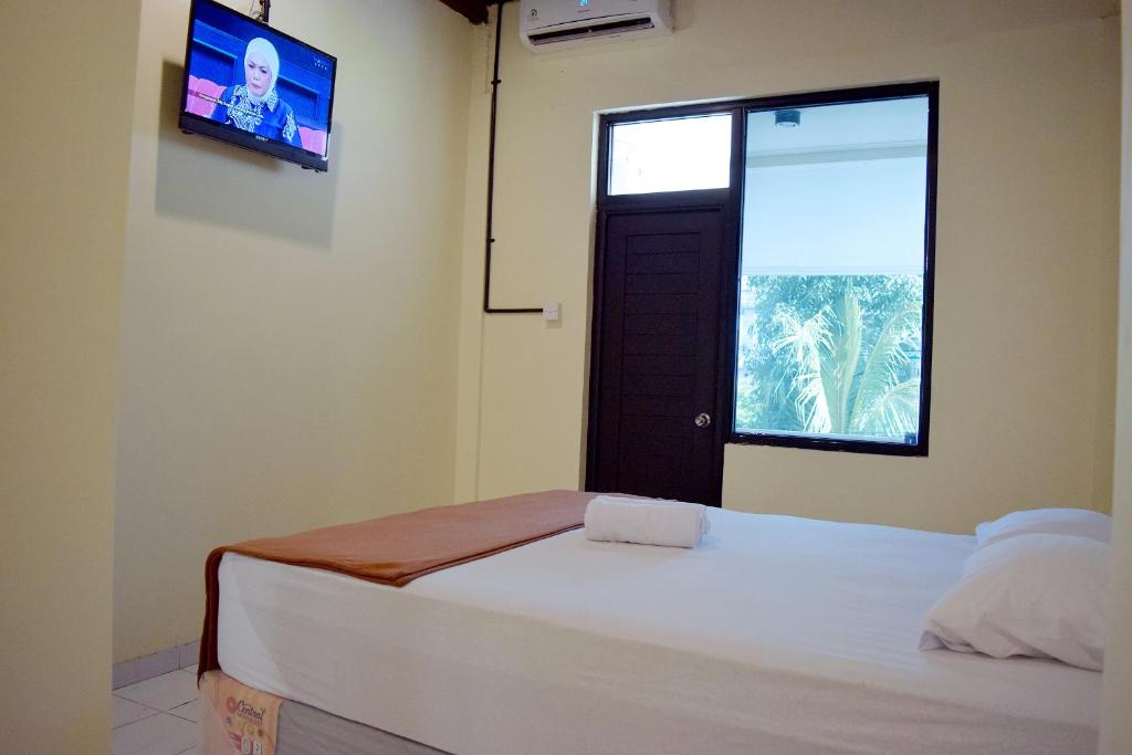 Postel nebo postele na pokoji v ubytování Tab Hotel Legian Bali