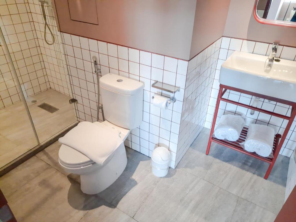 Koupelna v ubytování Kotta Hotel Semarang