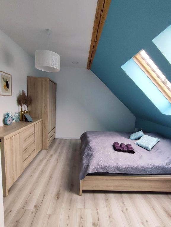 Posteľ alebo postele v izbe v ubytovaní Apartament Nad Góralem