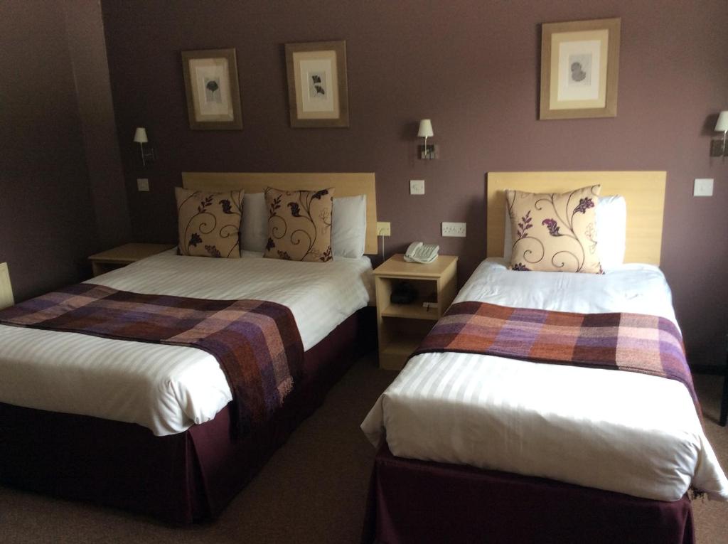 Postel nebo postele na pokoji v ubytování Yorkway Motel