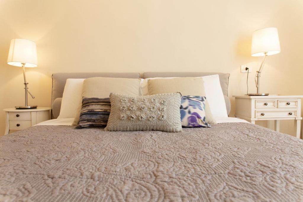 Łóżko lub łóżka w pokoju w obiekcie Casa delle Stelle Luxury