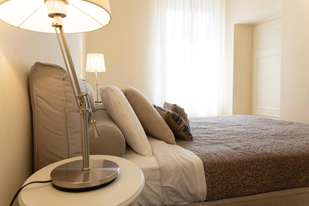 Łóżko lub łóżka w pokoju w obiekcie Casa delle Stelle Luxury
