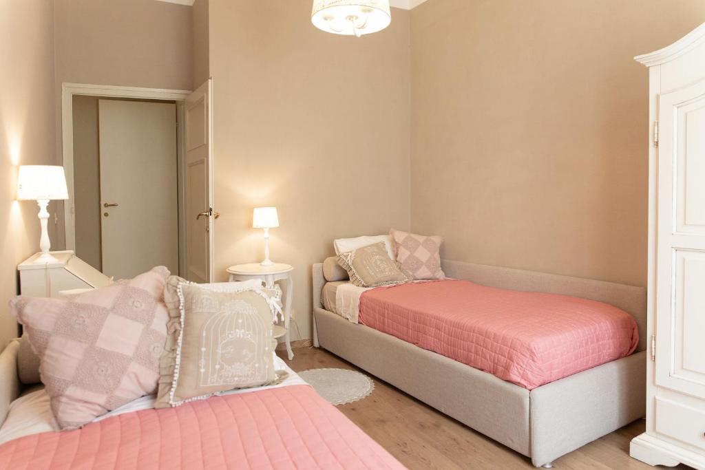 Łóżko lub łóżka w pokoju w obiekcie Casa delle Stelle Luxury