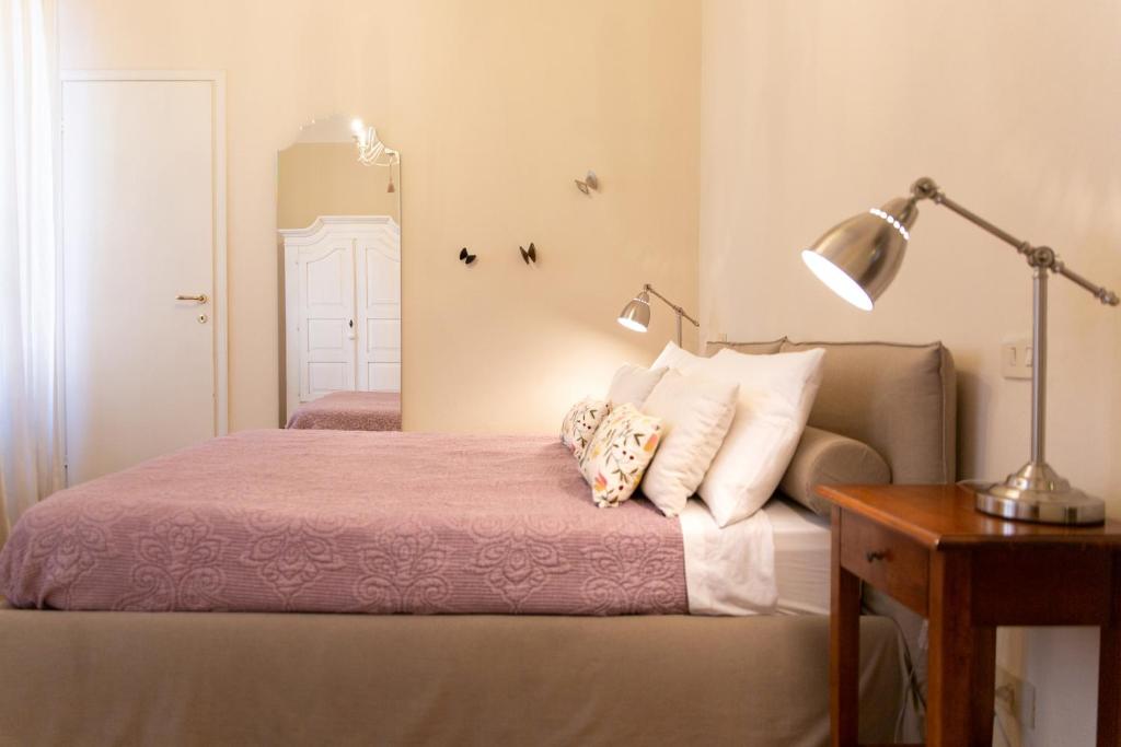 Łóżko lub łóżka w pokoju w obiekcie Casa delle Stelle Luxury