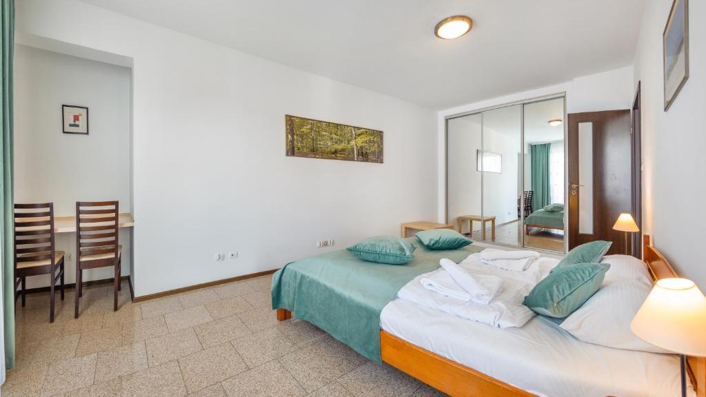 Posteľ alebo postele v izbe v ubytovaní Apartamenty Sun & Snow Marea