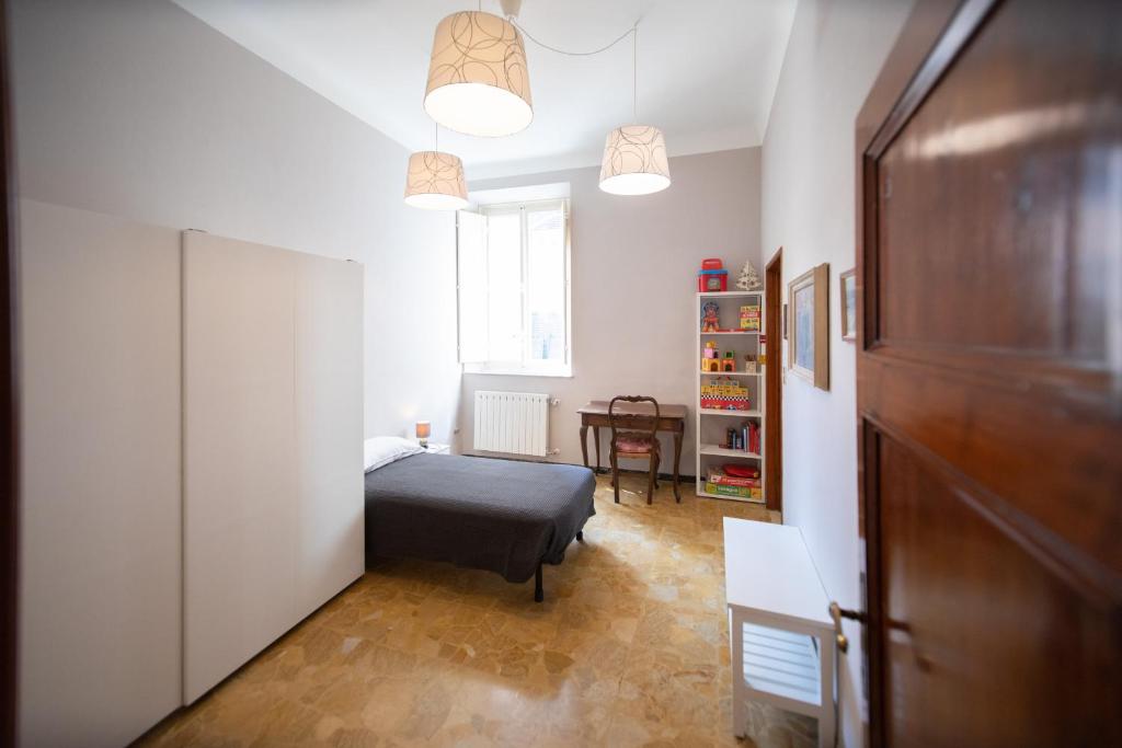 A bed or beds in a room at Re Migio Apartment with Terrace and Lift