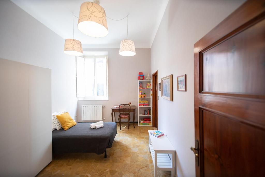 A bed or beds in a room at Re Migio Apartment with Terrace and Lift