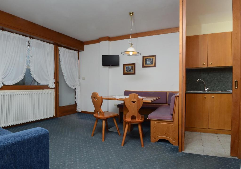 Televízia a/alebo spoločenská miestnosť v ubytovaní Ski Residence