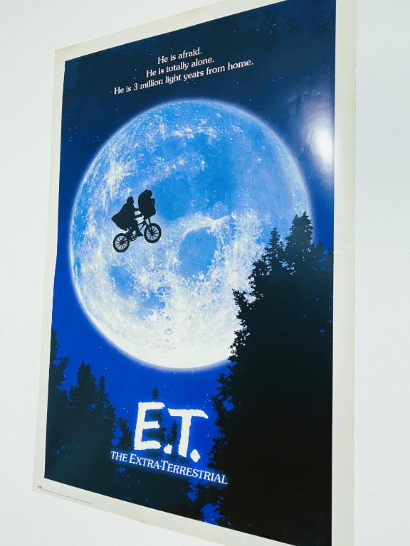 a poster of a person riding a bike on the moon at Apartman JakoDoma vlastní parkování u domu ZDARMA in Česká Lípa