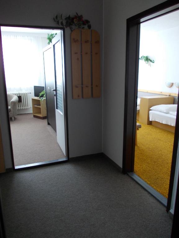 Postel nebo postele na pokoji v ubytování Hotel Milotel