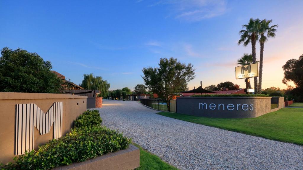 a driveway of a home with a sign that reads menezes at Motel Meneres in Corowa