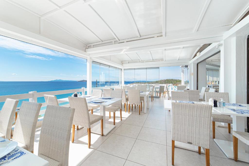 a restaurant with a view of the ocean at Hotel Perrakis in Kipri
