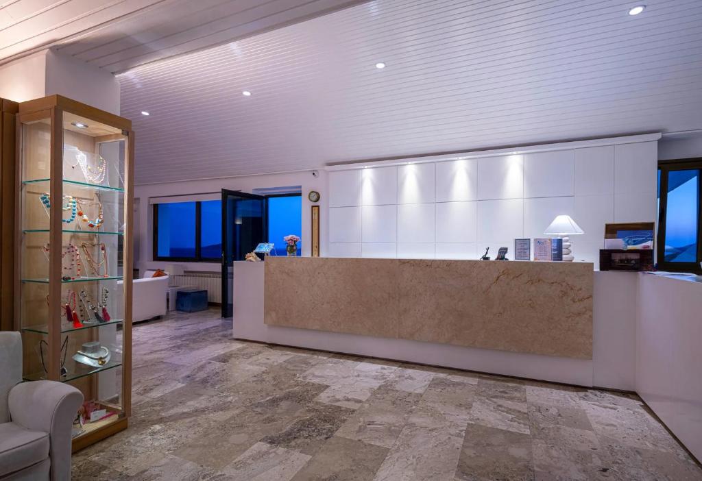 a lobby with a large counter in a room at Hotel Perrakis in Kipri