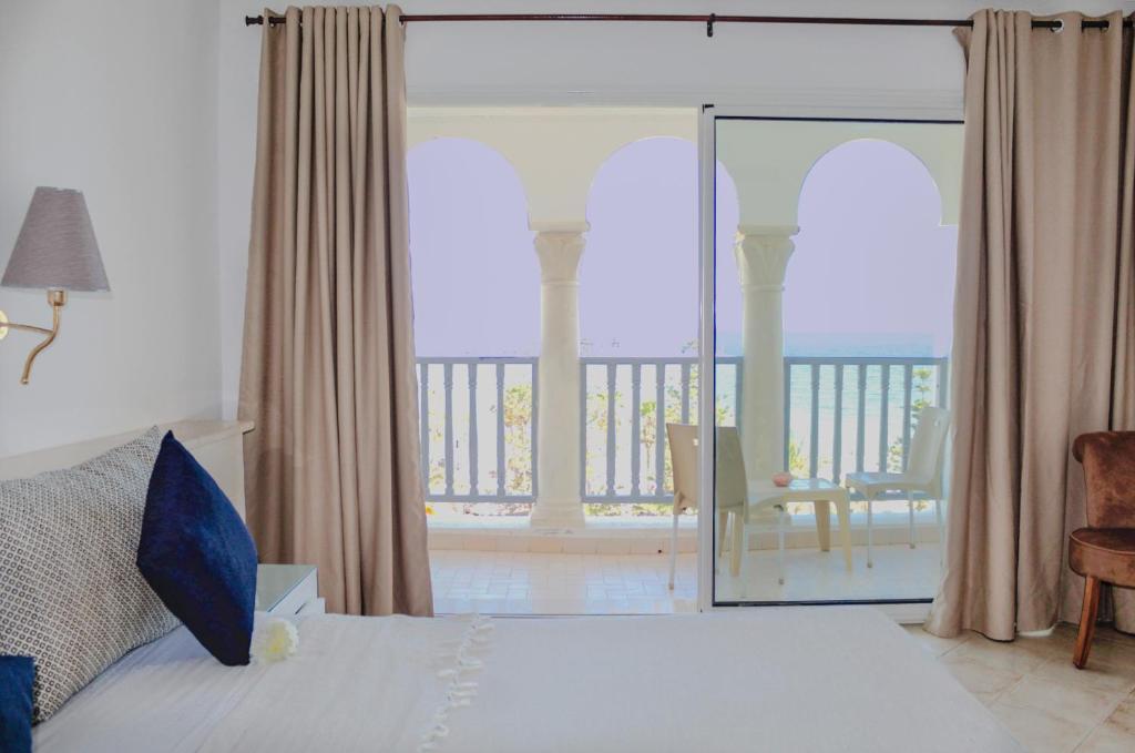 Voodi või voodid majutusasutuse Hotel El Habib Monastir toas