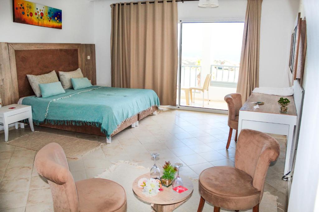 Voodi või voodid majutusasutuse Hotel El Habib Monastir toas