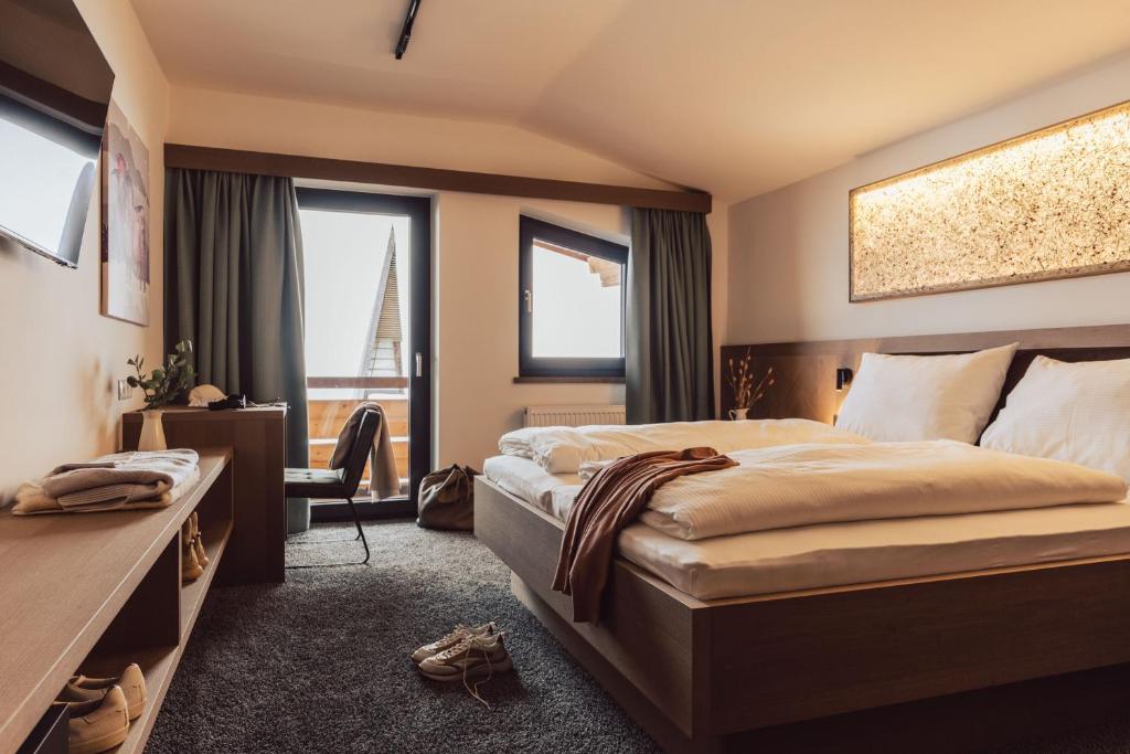Postel nebo postele na pokoji v ubytování Hotel Lisl - Alpine Comfort