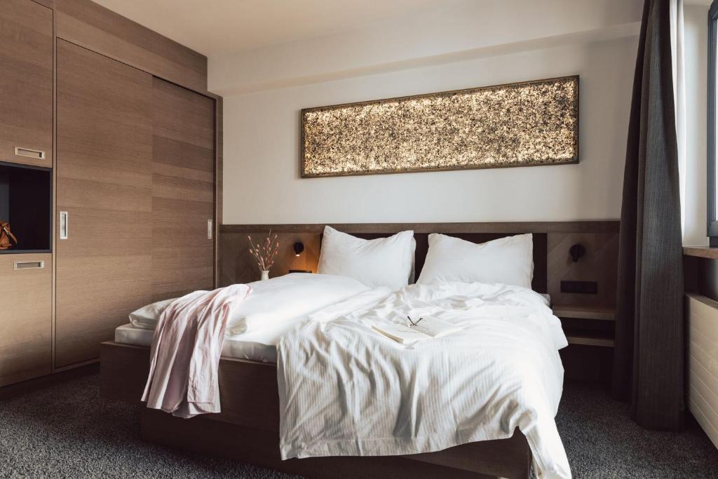 Postel nebo postele na pokoji v ubytování Hotel Lisl - Alpine Comfort