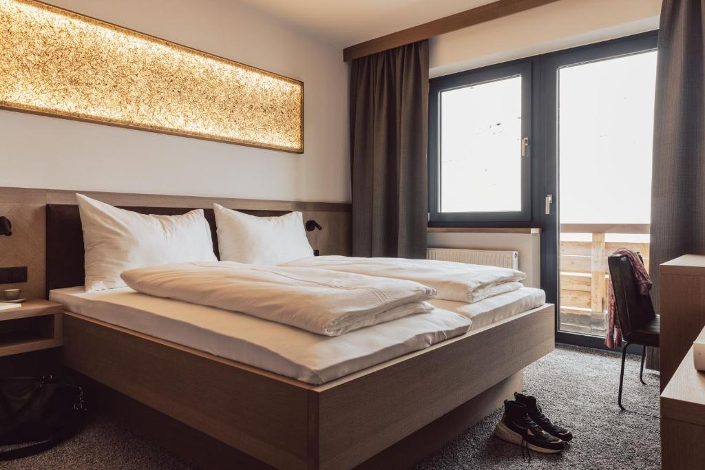 Postel nebo postele na pokoji v ubytování Hotel Lisl - Alpine Comfort