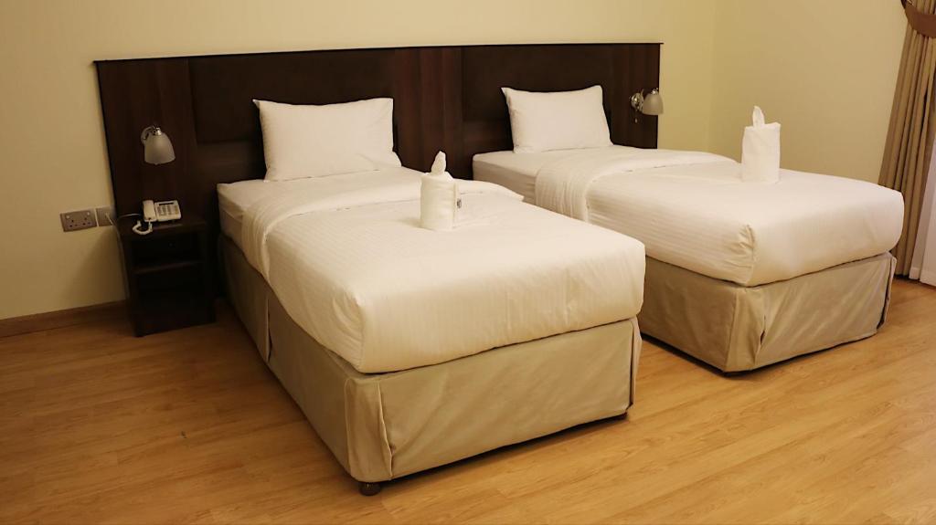 Postel nebo postele na pokoji v ubytování Weekdays Hotel