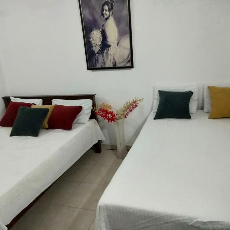 Postel nebo postele na pokoji v ubytování Hellen homestay