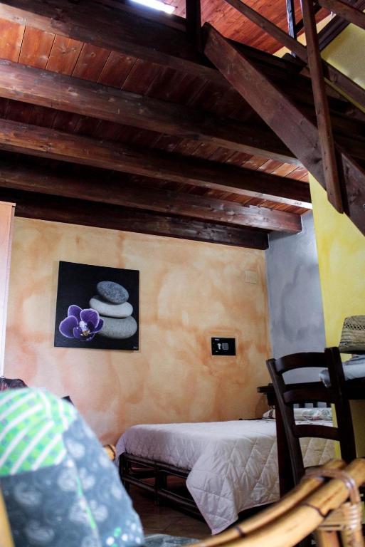 Postel nebo postele na pokoji v ubytování Agriturismo Su Niu