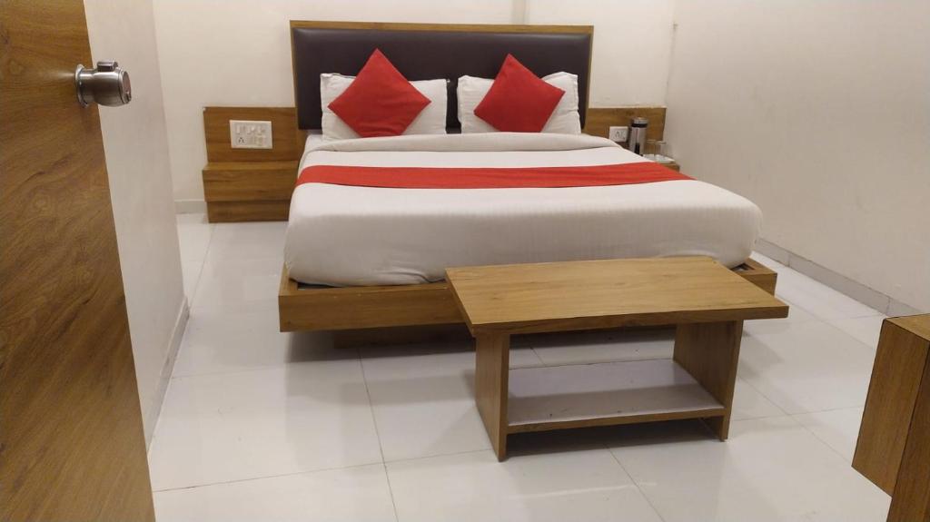 Postel nebo postele na pokoji v ubytování Hotel Maan Palace