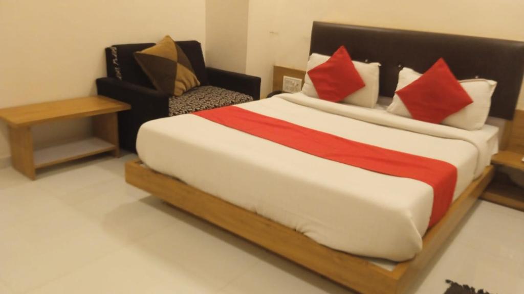 Postel nebo postele na pokoji v ubytování Hotel Maan Palace
