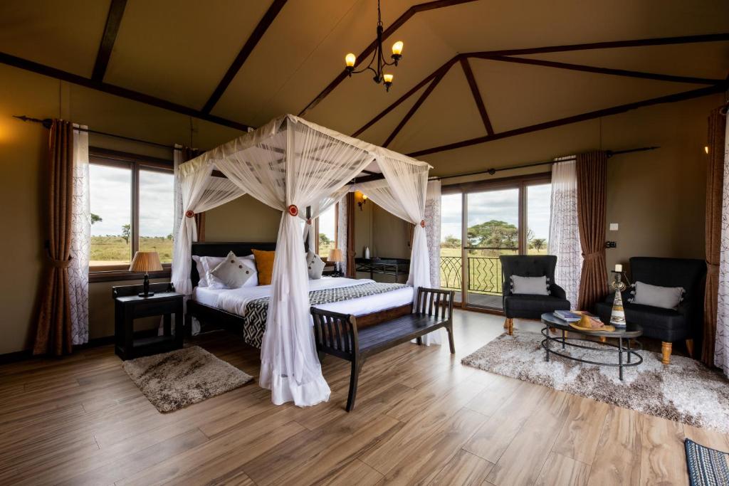 Postel nebo postele na pokoji v ubytování Serengeti Sametu Camp