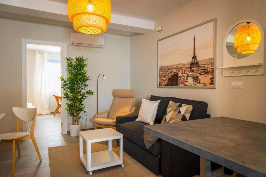 a living room with a couch and a table at Apartment Dolmen de Menga in Antequera