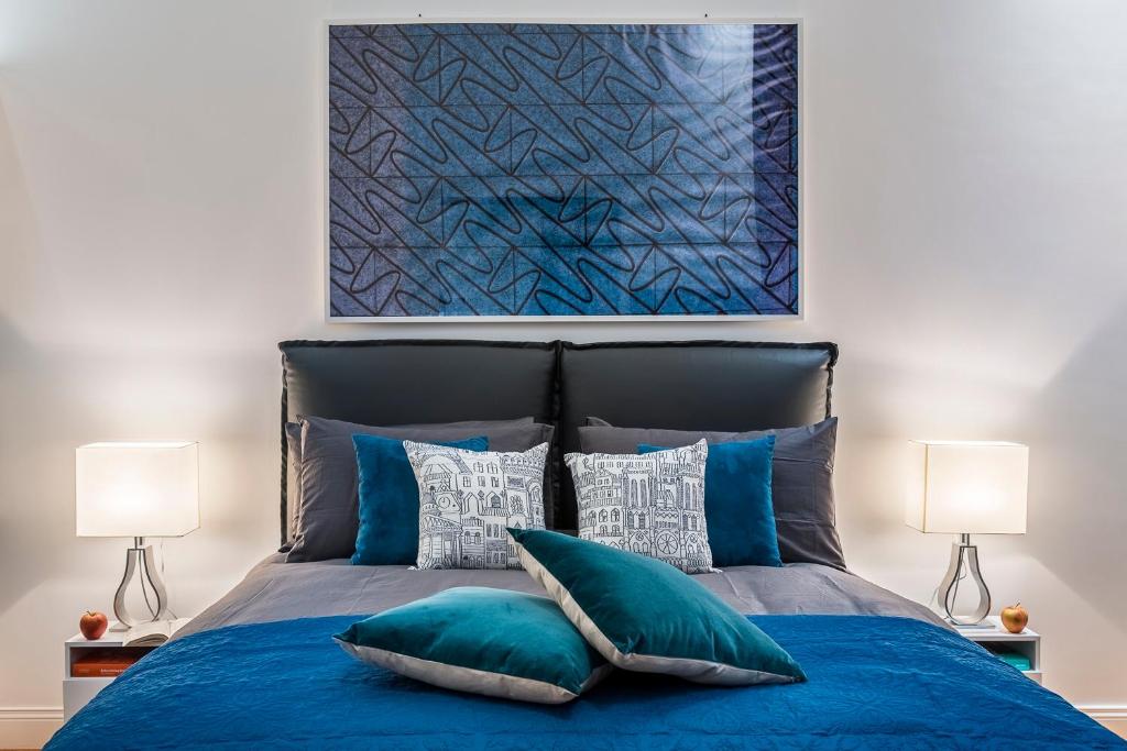 A bed or beds in a room at Argentina Residenza Style Hotel