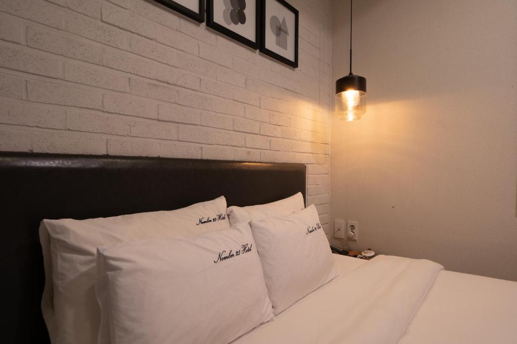 Postel nebo postele na pokoji v ubytování No25 Hotel Yeonsan