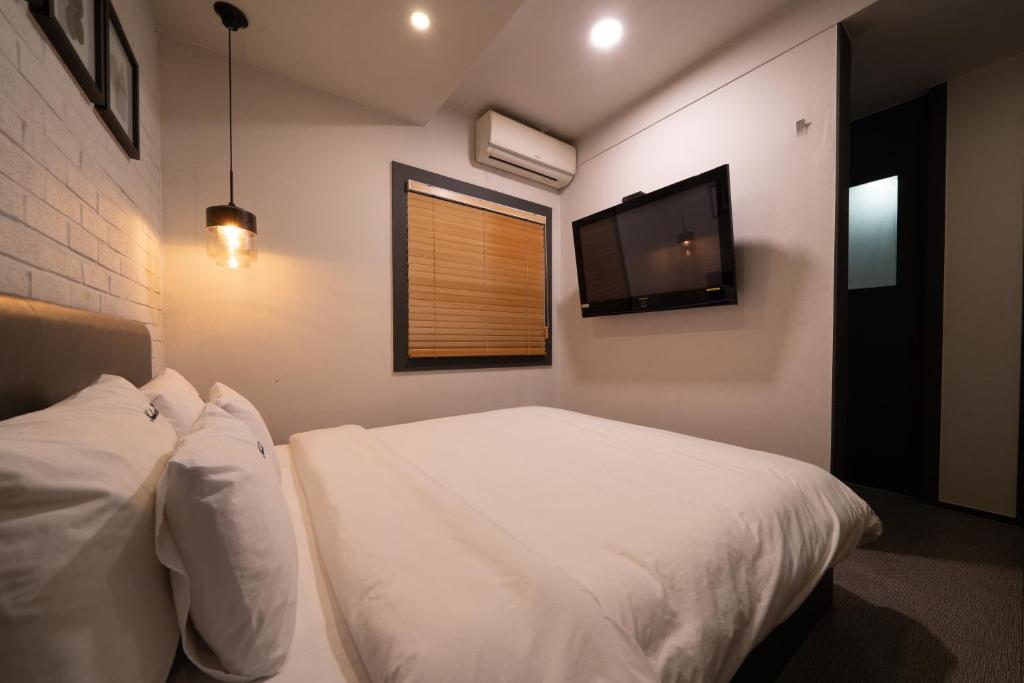 Postel nebo postele na pokoji v ubytování No25 Hotel Yeonsan