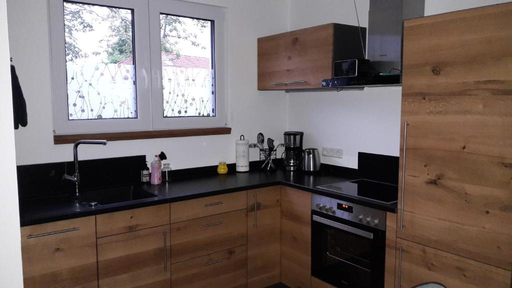 Kuchyň nebo kuchyňský kout v ubytování Ferienhaus Bug