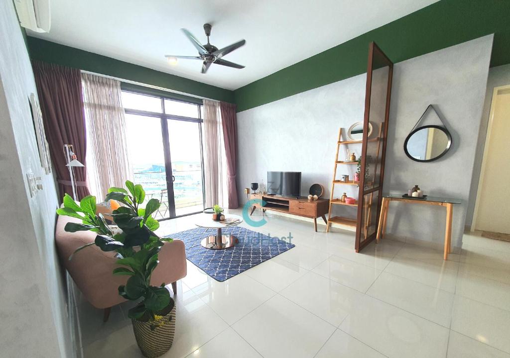 a living room with a couch and a ceiling fan at Apartment Near IOI Resort City Shopping Mall Serdang Putrajaya in Putrajaya
