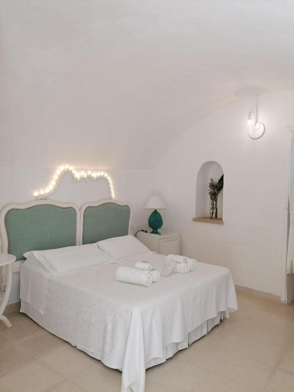 Postel nebo postele na pokoji v ubytování Palazzo De Mori